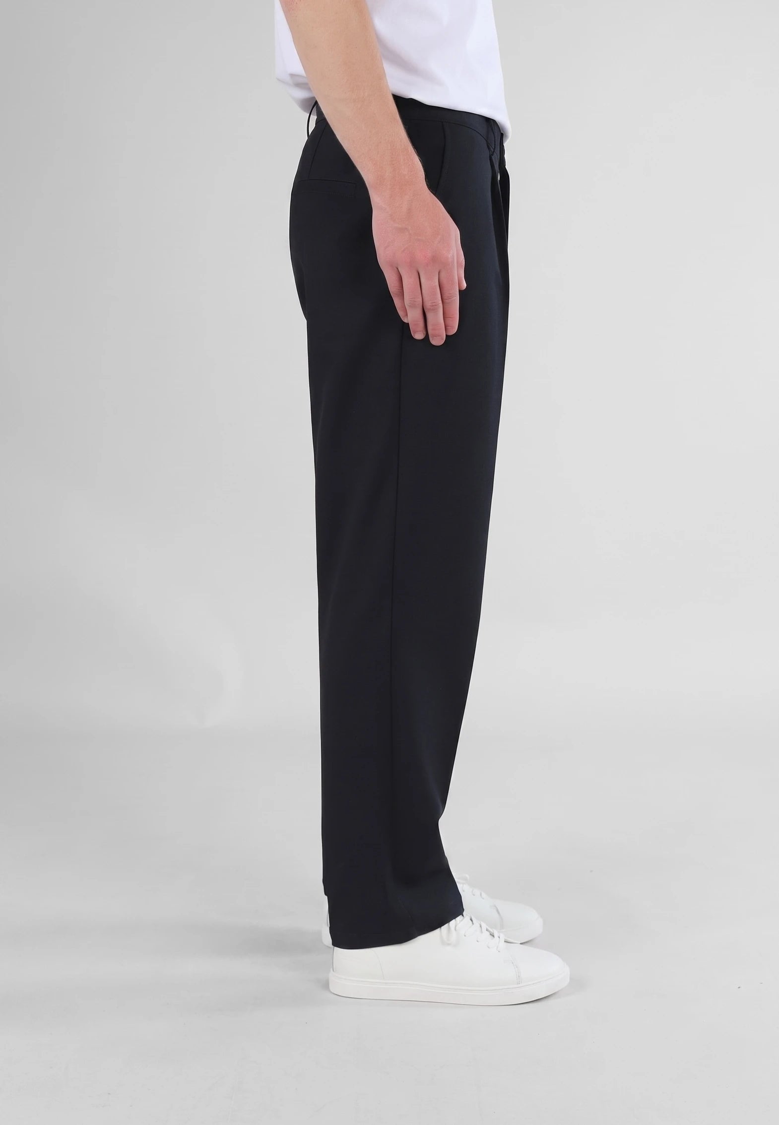 Ethan Heavy Relaxed Fit trousers - Deep navy, side view on model