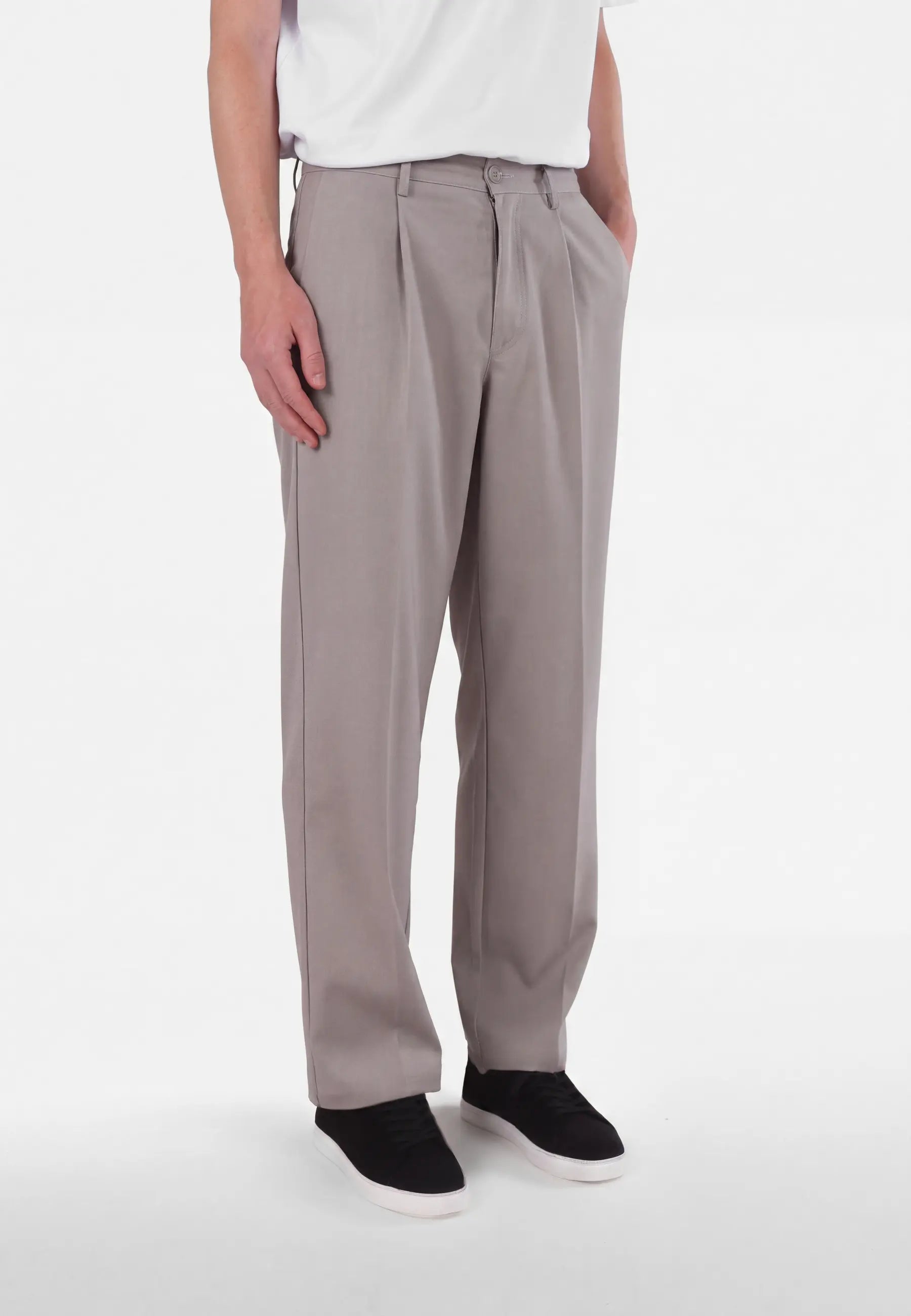 Ethan Heavy Relaxed Fit trousers - Dusty clay taupe, side view on model
