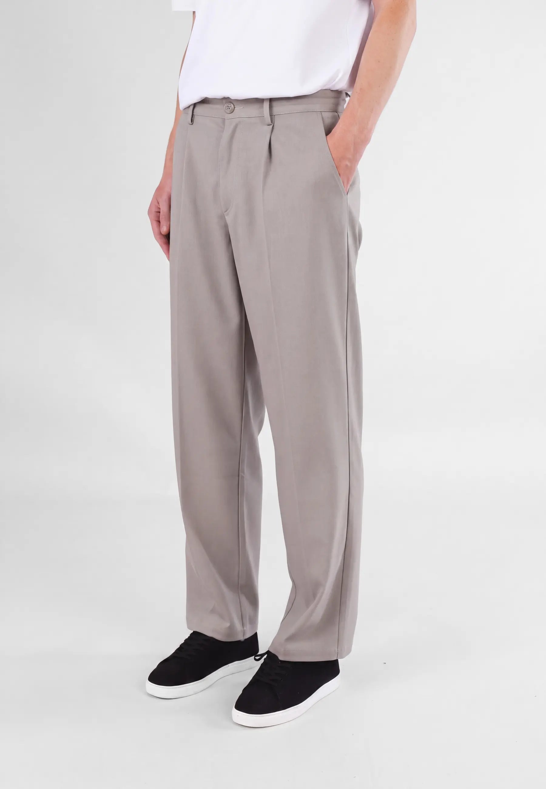 Ethan Heavy Relaxed Fit trousers - Dusty clay taupe, side view on model