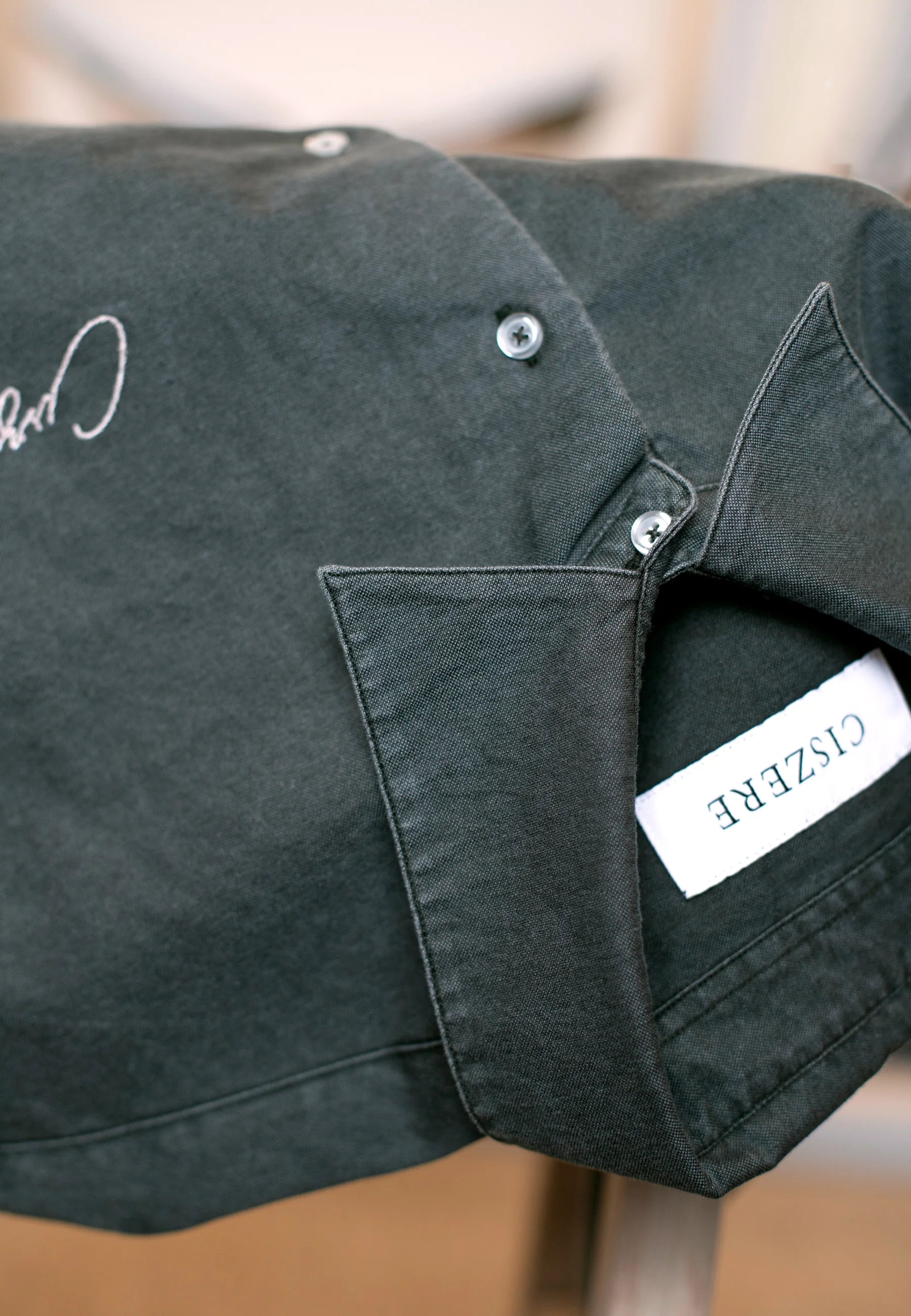 Ciszere AW26 Past Forward - jacket pocket and label detail