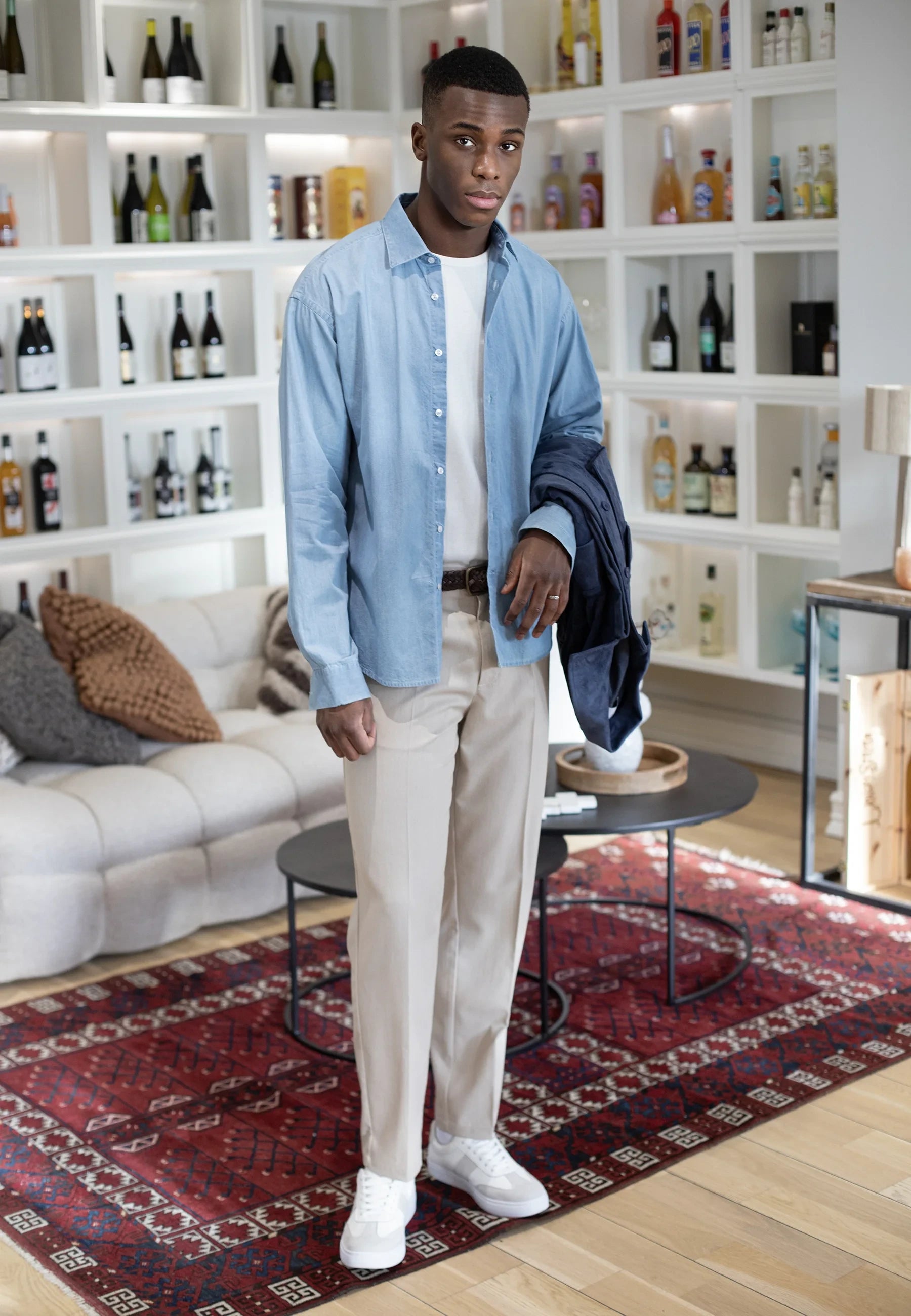 Ciszere editorial - washed denim shirt with jacket in hand